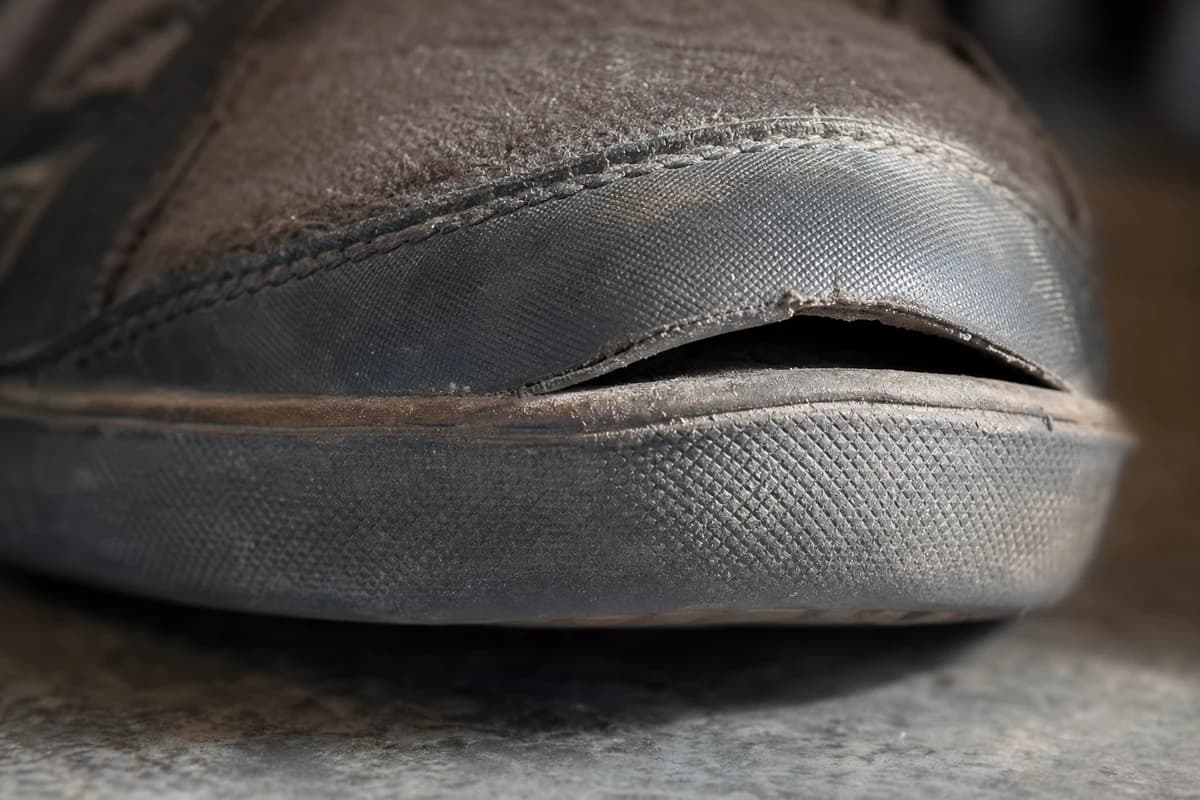 Detail of a separated sole edge showing candidates for shoe restoration Dubai