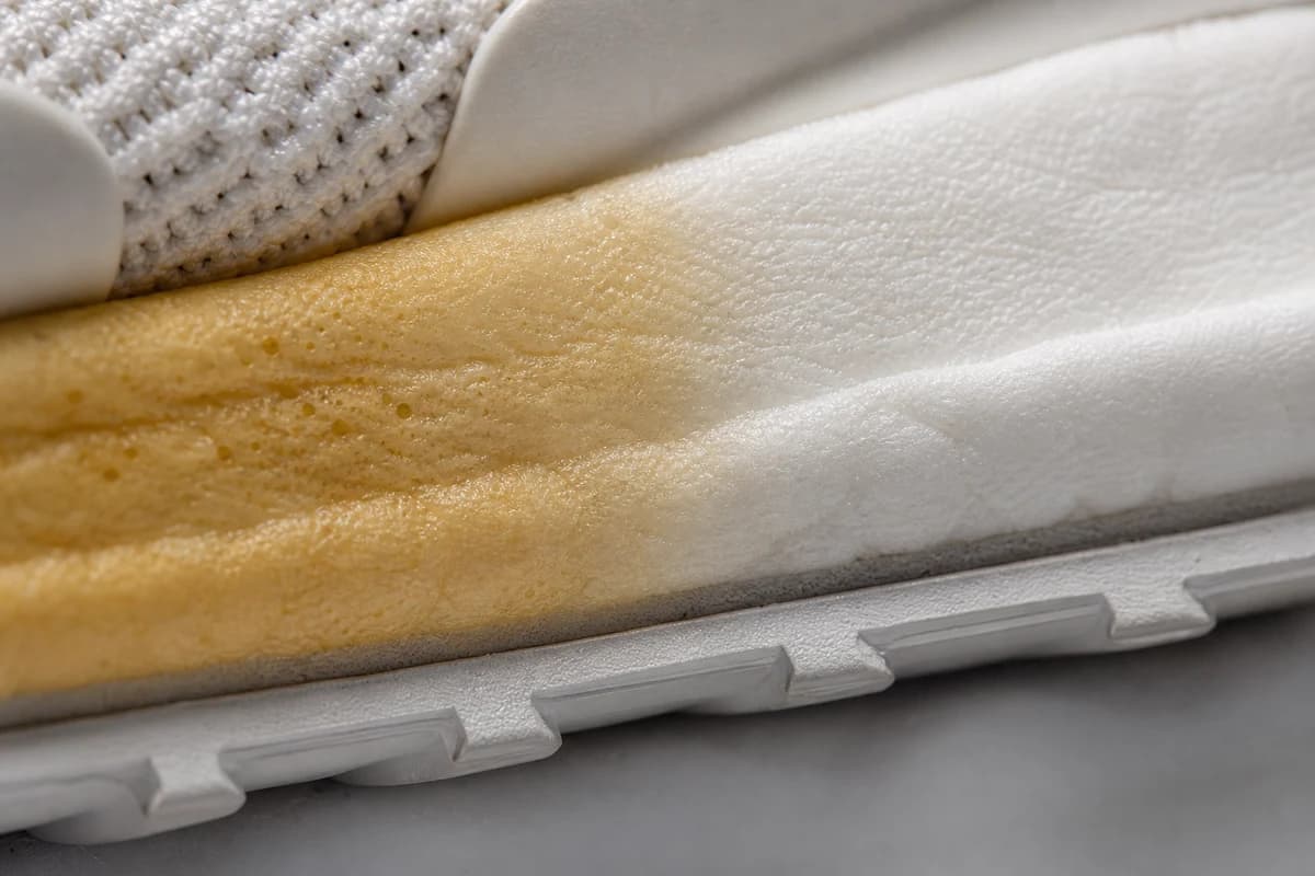 Close-up of amber midsole edge before yellow sole whitening Dubai treatment
